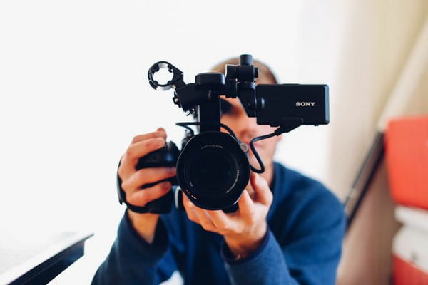 Videographer Holding Video Camera