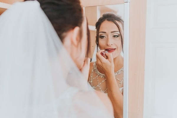 Bride doing lipstick