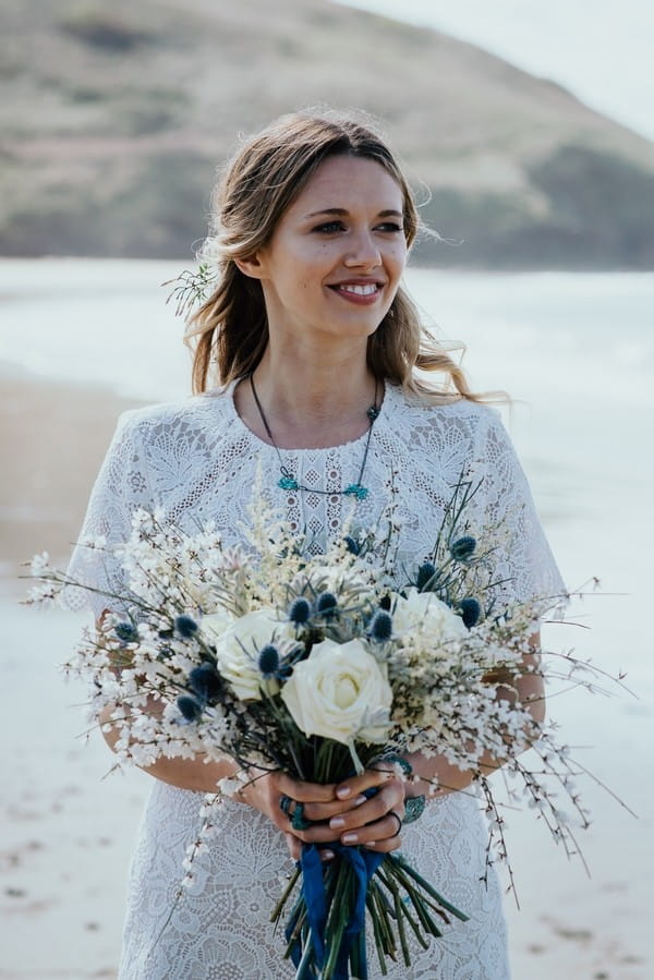 Bride holding rustic bouquet