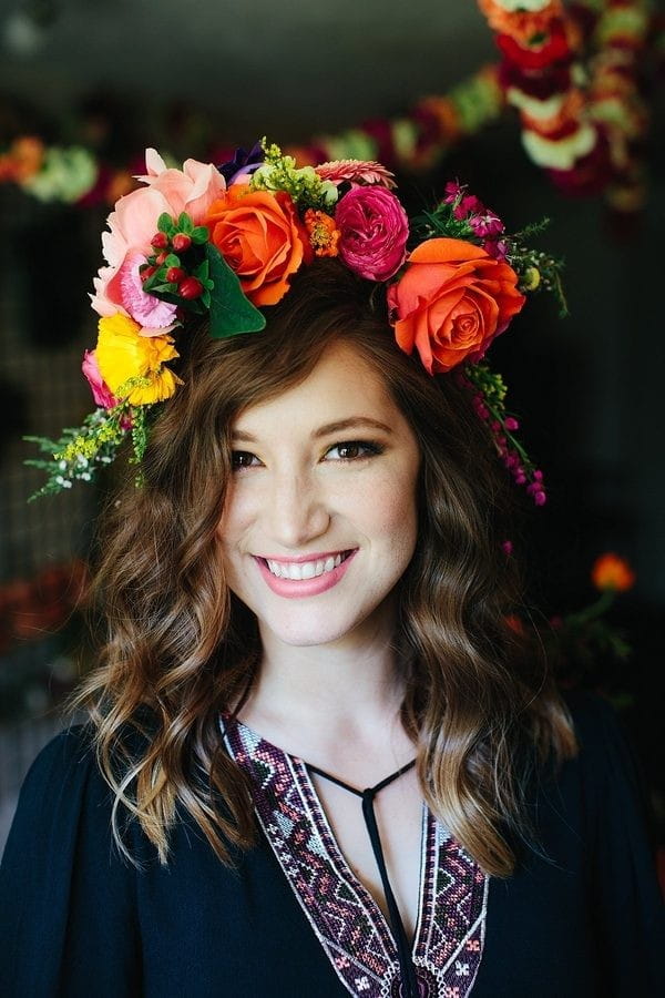 Woman wearing colourful floral crown