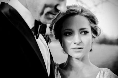 Close up of bride's face standing next to groom - Picture by Tony Hart Photography