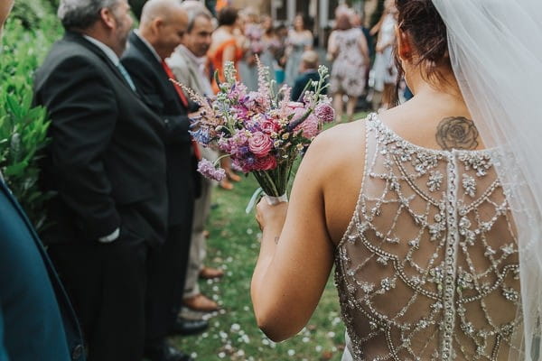 Beaded detail on back of bride's wedding dress