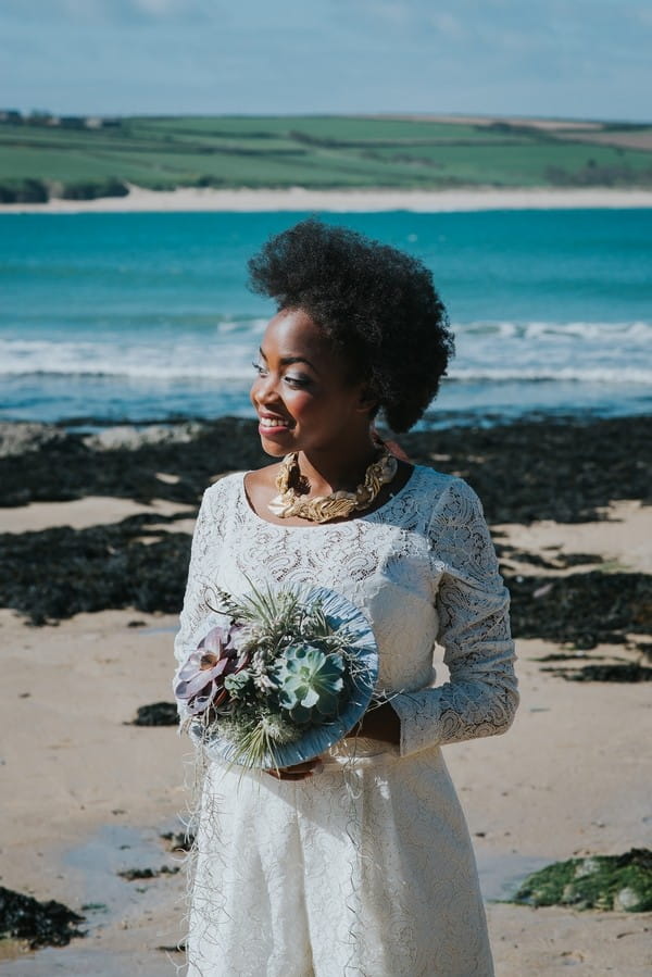 Bride with afro holding bouquet