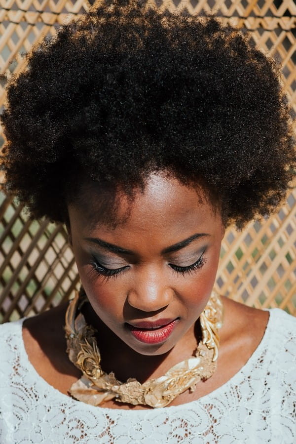 Bride with afro looking down