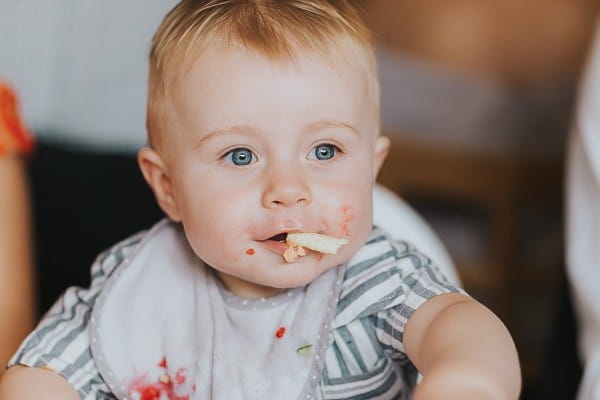 Toddler eating at wedding