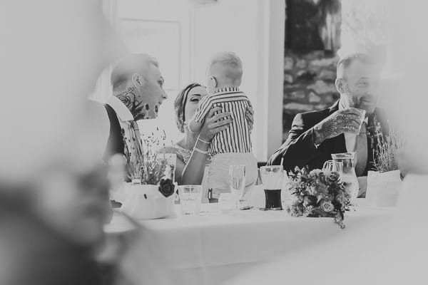 Bride and groom with child