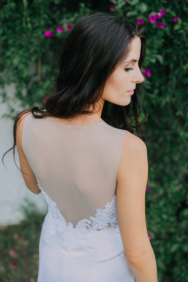 Illusion panel on back of bride's wedding dress