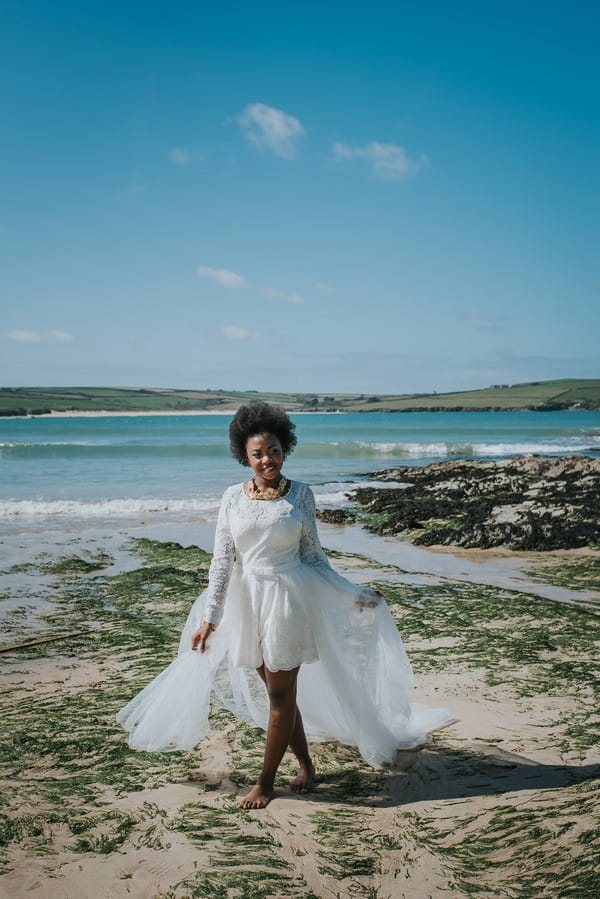 Bride walking on beach