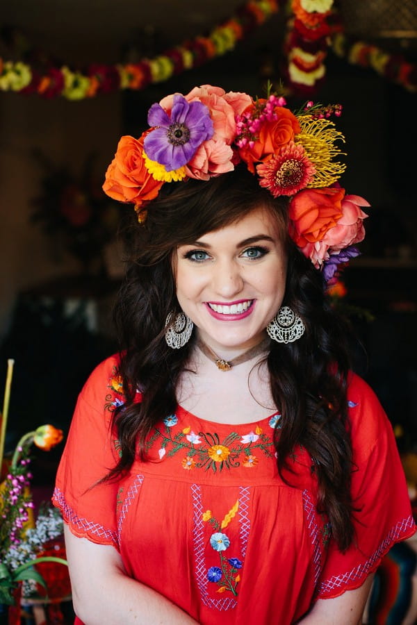 Woman wearing colourful flower crown