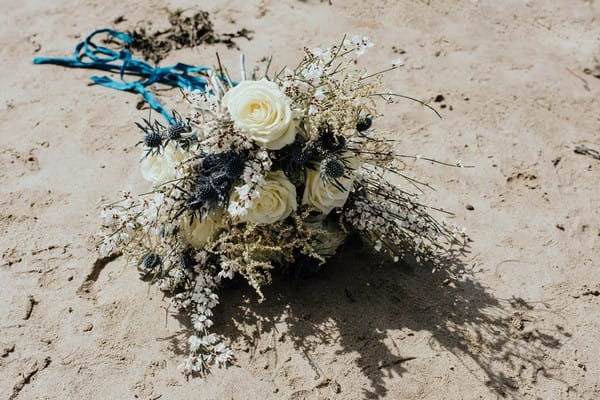 Rustic wedding bouquet on beach