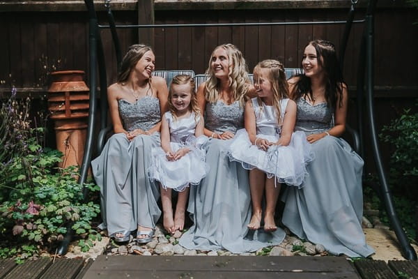 Bridesmaids and flower girls in silver/grey dresses