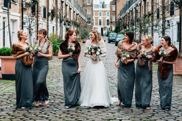 Bride and bridesmaids walking down street - Picture by Damion Mower Photography