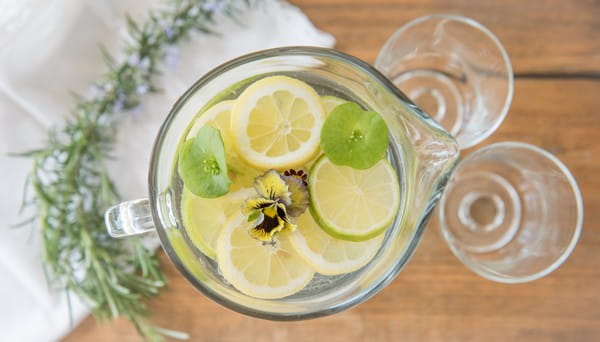 Jug of water with lemon and lime slices