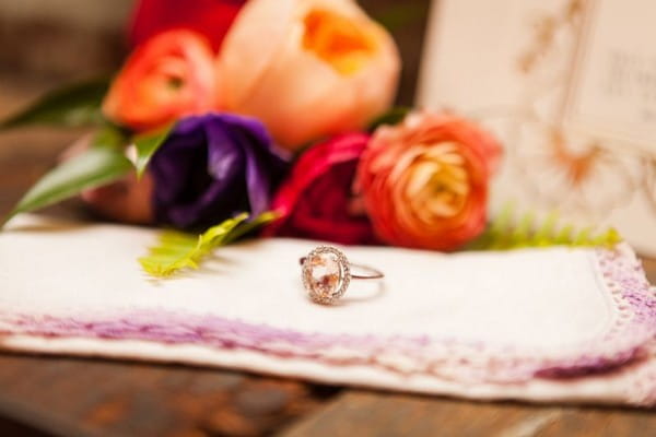 Wedding ring next to colourful flowers