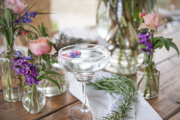 Cocktail and vases of flowers