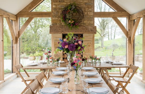 Long rustic table with homegrown flower styling