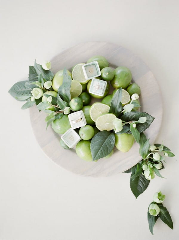 Wedding rings in bowl of limes
