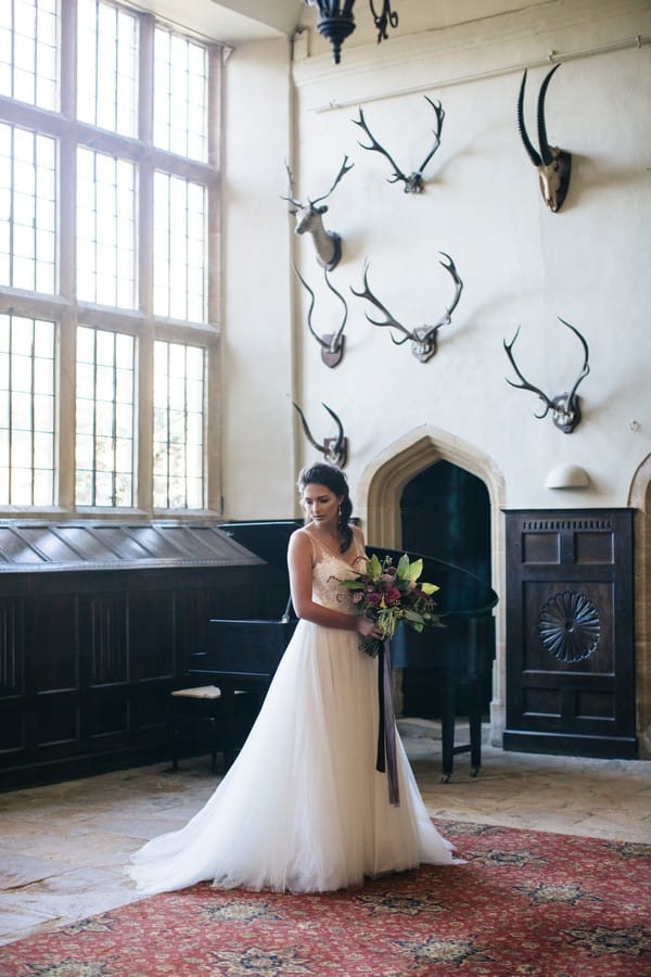 Bride holding bouquet in Brympton House
