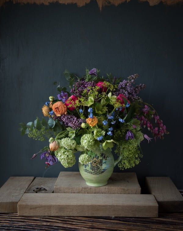 Vase of colourful homegrown flowers