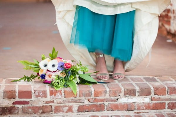 Bridal bouquet and bride's teal underskirt