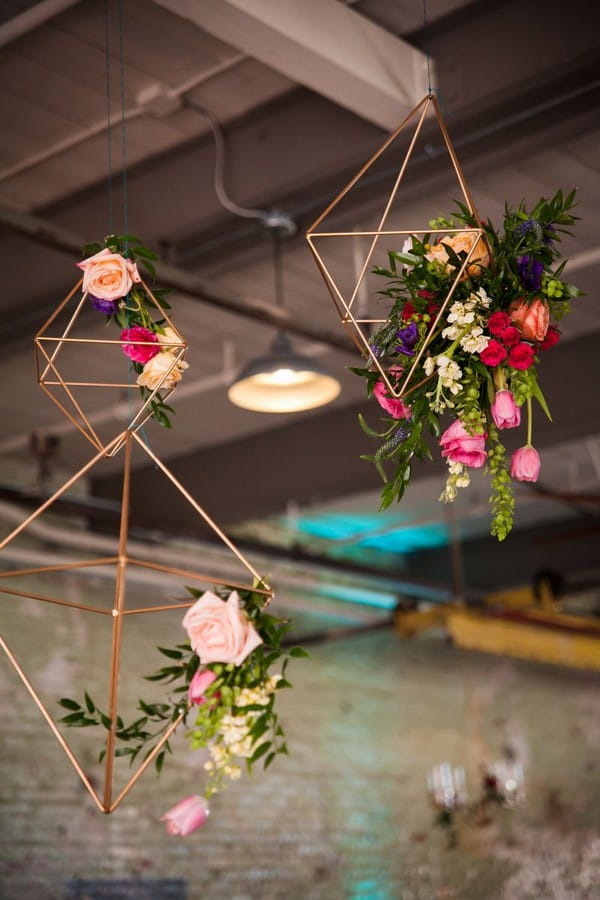 Geometric shapes with flowers hanging from ceiling
