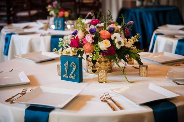 Colourful floral wedding table centrepiece