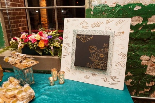 Wedding guest book with gold flowers drawn on