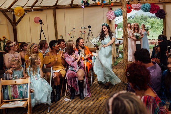 Bridesmaid Dancing Down Wedding Aisle