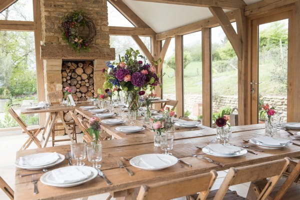 Rustic wedding tables with homegrown flower displays