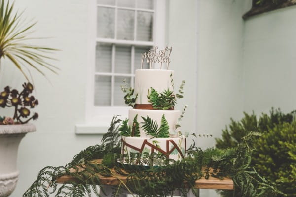 Wedding cake by Claire's Sweet Temptations covered in fern