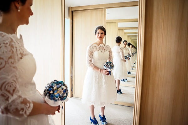 Bride looking at herself in mirror