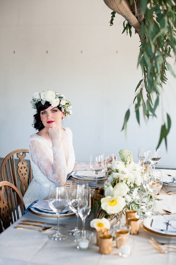 Bride sitting at elegant wedding table