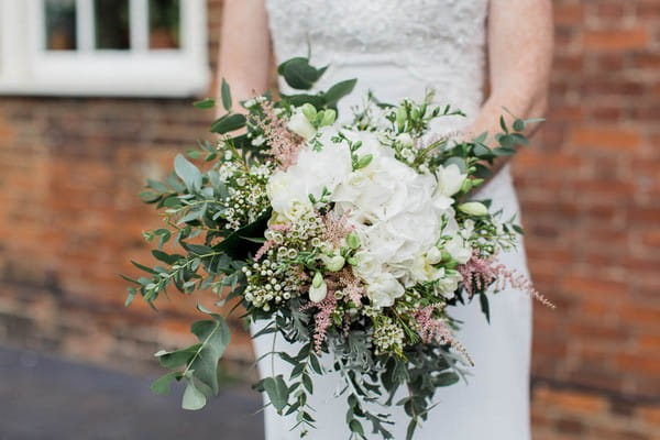 Bridal bouquet with white flowers and foliage