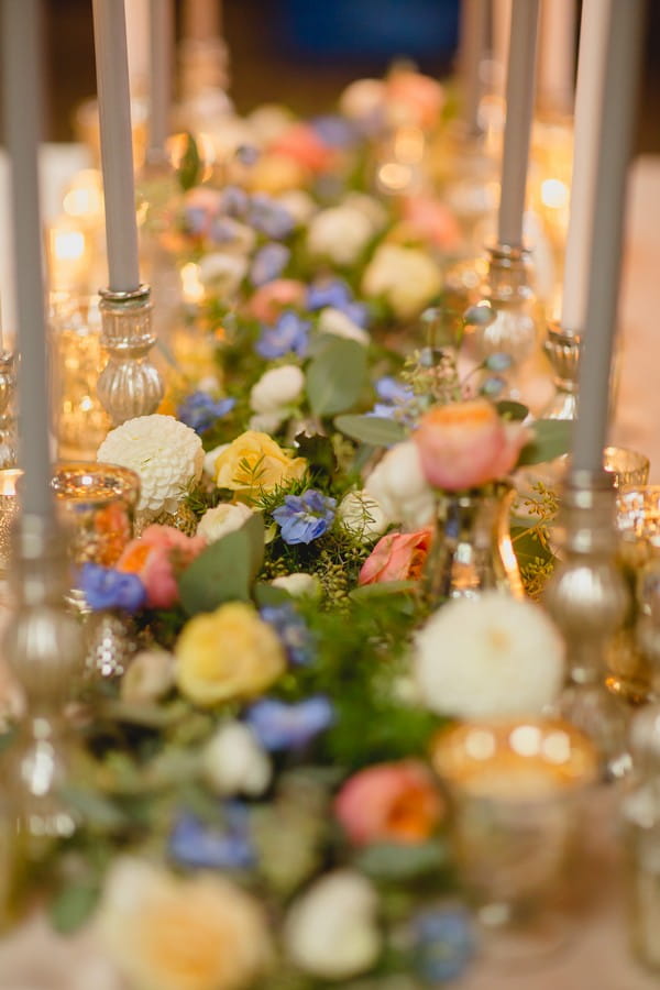 Pink, blue, yellow and white flowers with foliage