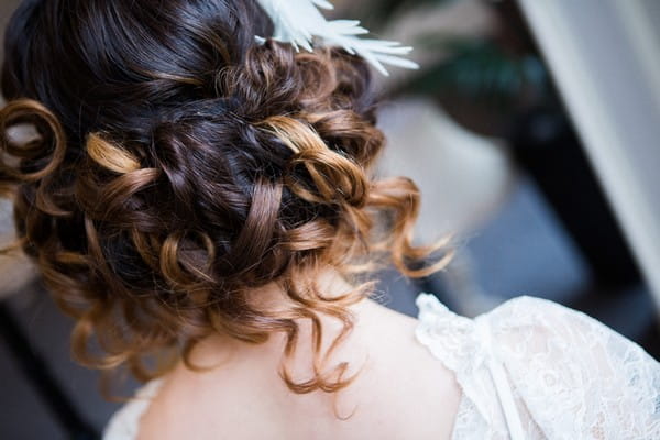 Back of bride's curled bob updo hairstyle
