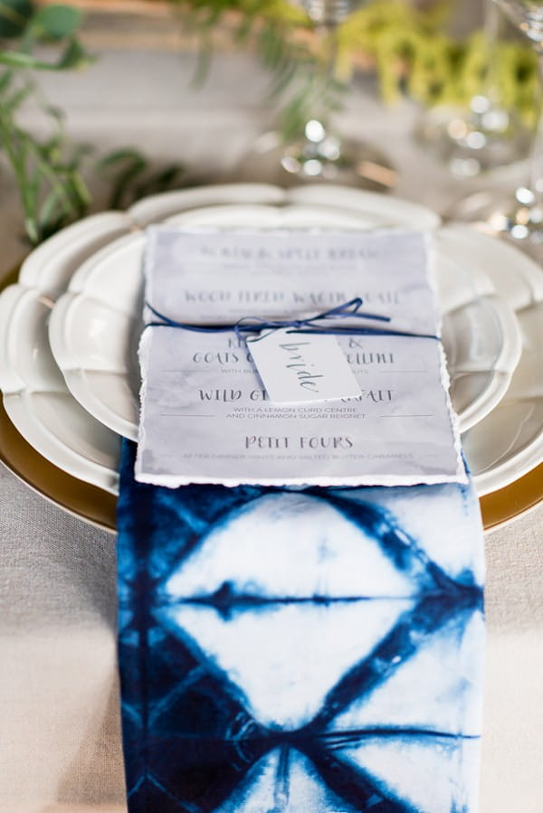 Wedding menu on top of indigo Shibori napkin