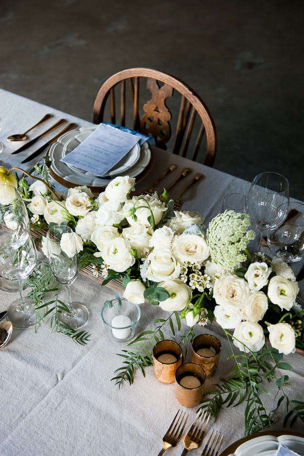 Wedding table centrepiece of white flowers