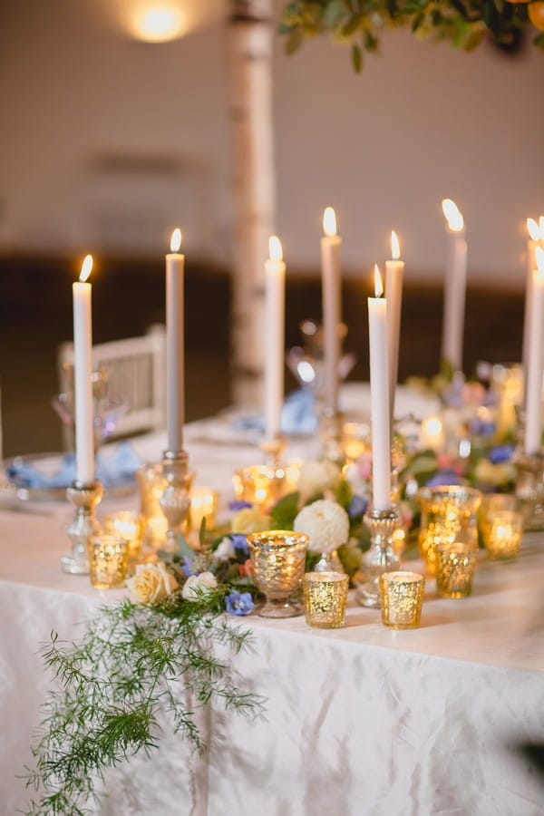 Floral and candle wedding table centrepiece