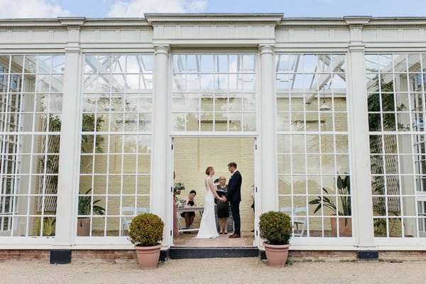 Wedding ceremony in orangery at Langtons House