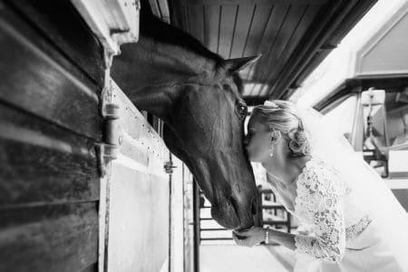 Bride kissing horse on the nose - Picture by Duncan Kerridge Photography