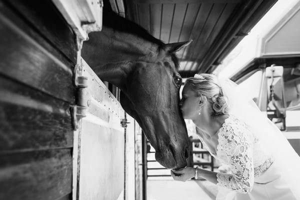Bride kissing horse on the nose - Picture by Duncan Kerridge Photography