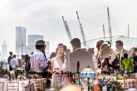 Reflection in window of wedding drinks reception with O2 Arena in background - Picture by Paul Rogers Photographer