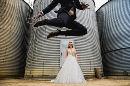 Groom jumping above bride - Picture by Aaron Storry Photography