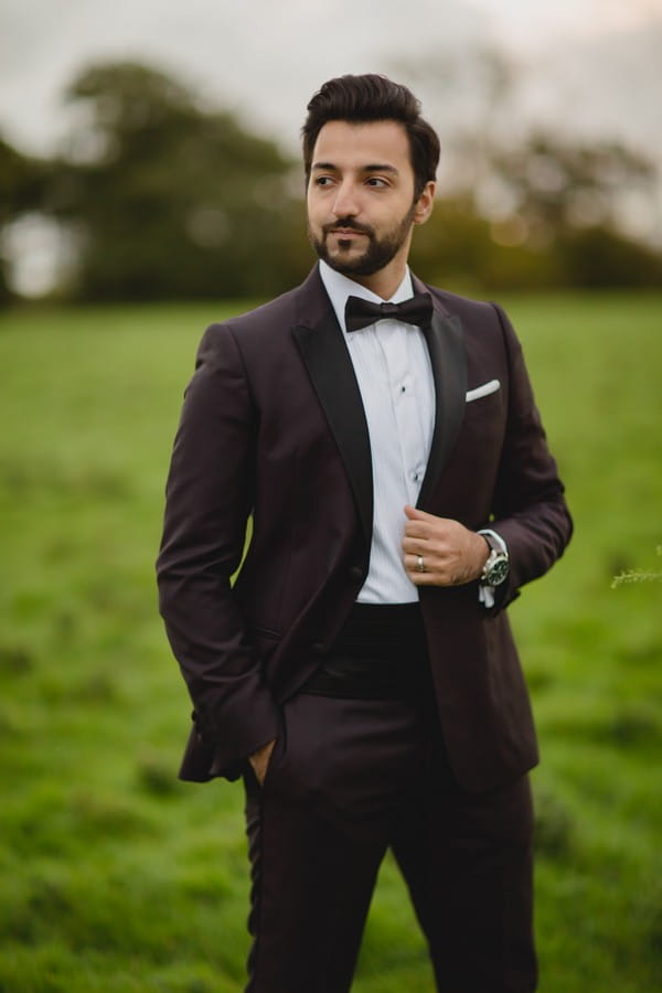 Groom wearing black tuxedo