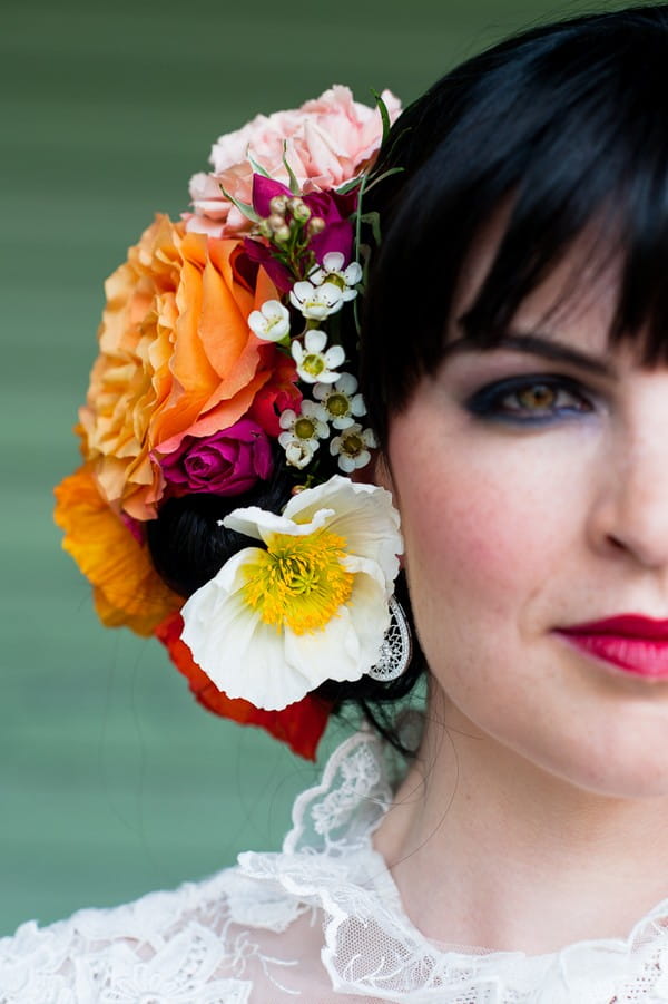 Colourful flowers in bride's hair