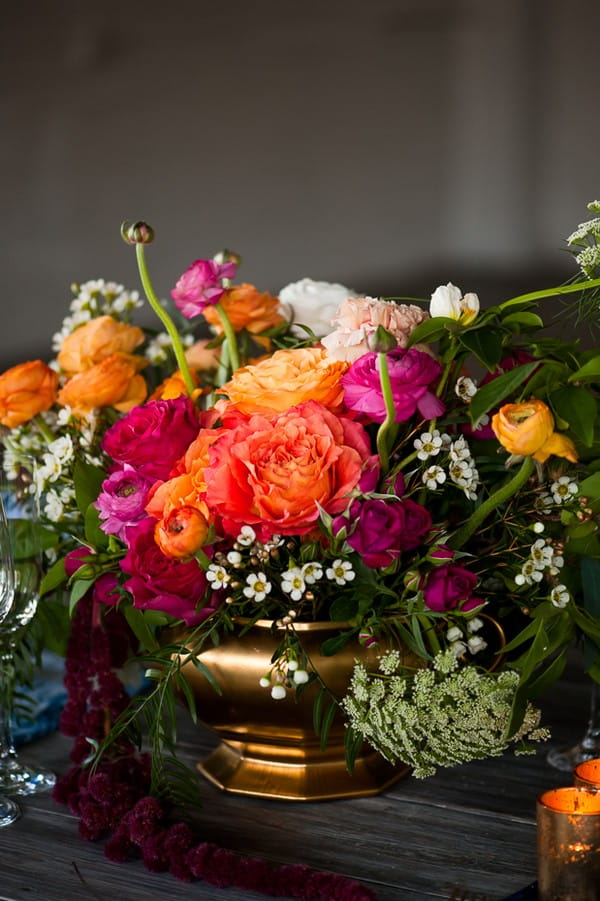 Bright, colourful wedding table flowers