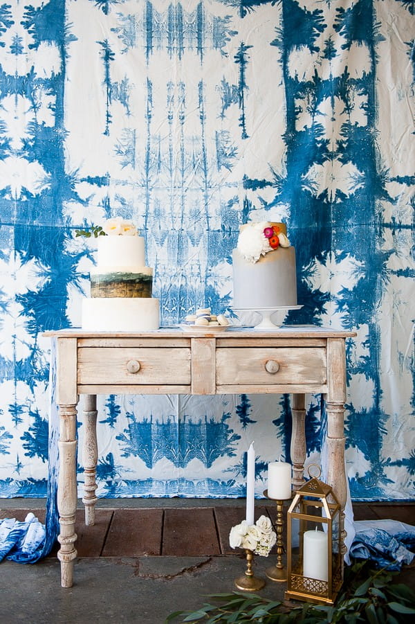 Two wedding cakes on dresser