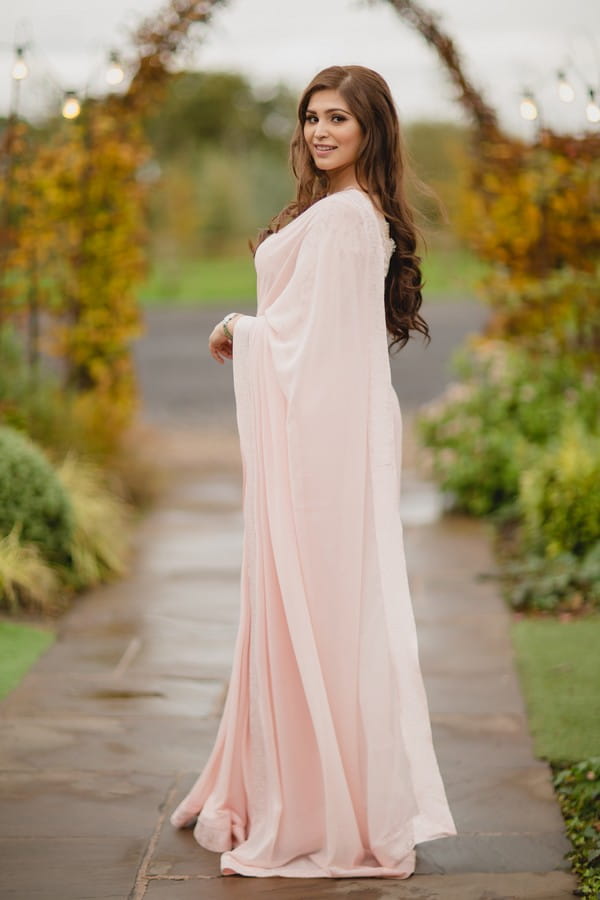 Bride in long light pink gown