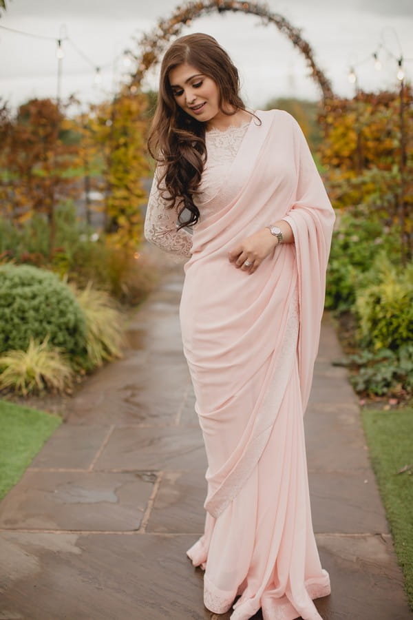 Bride wearing long pink gown