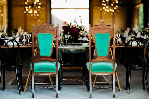 Bride and groom chairs at top table